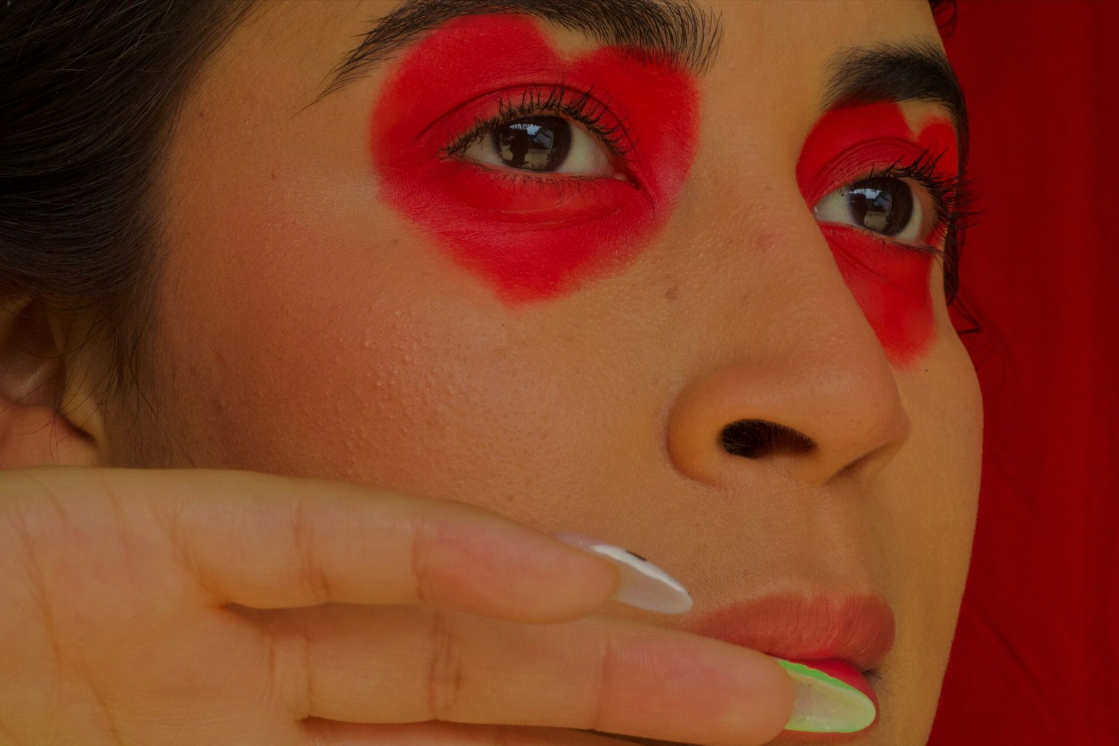 a woman with red paint on her face