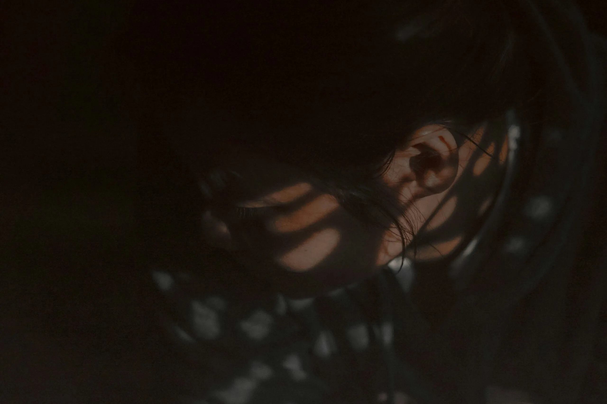 a close up of a person's face in the dark
