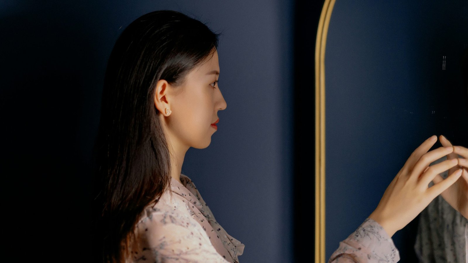 woman in white floral shirt