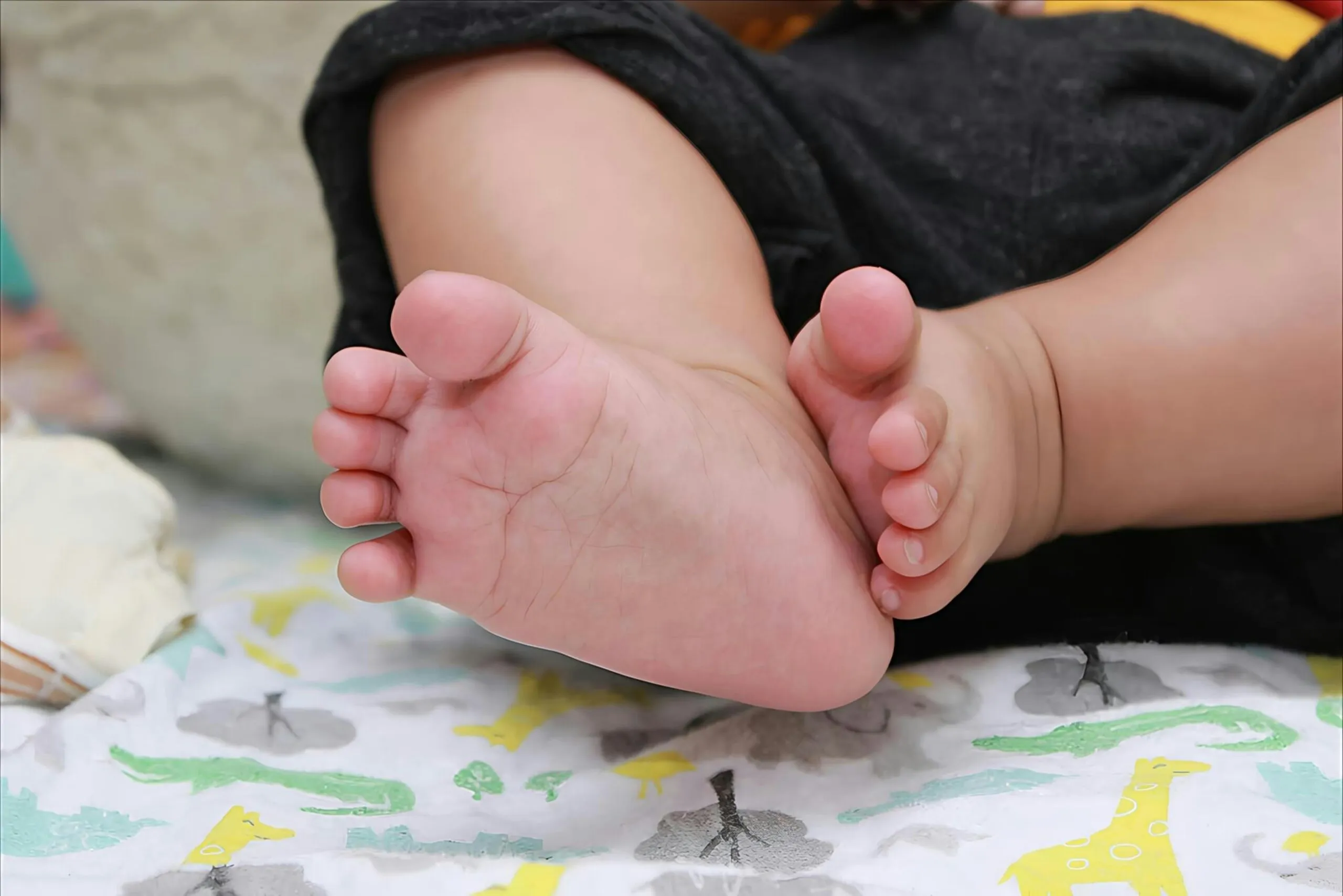 Close up of a baby's tiny feet resting