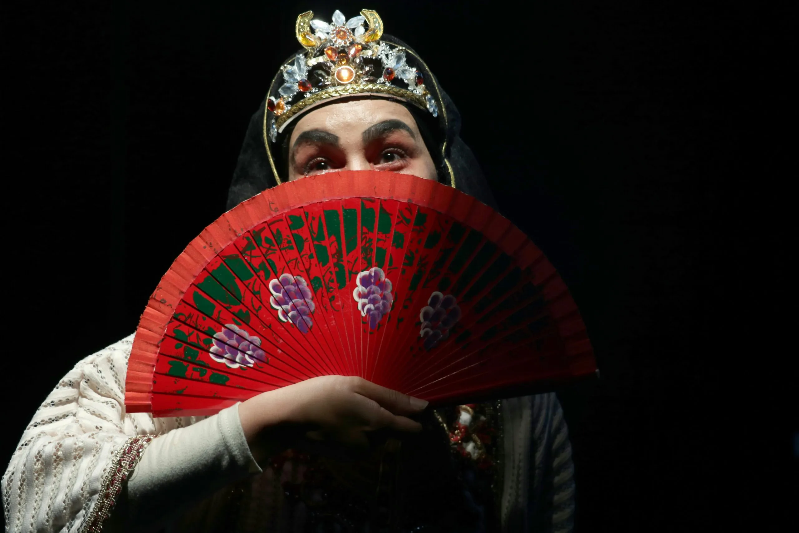 red and green hand fan
