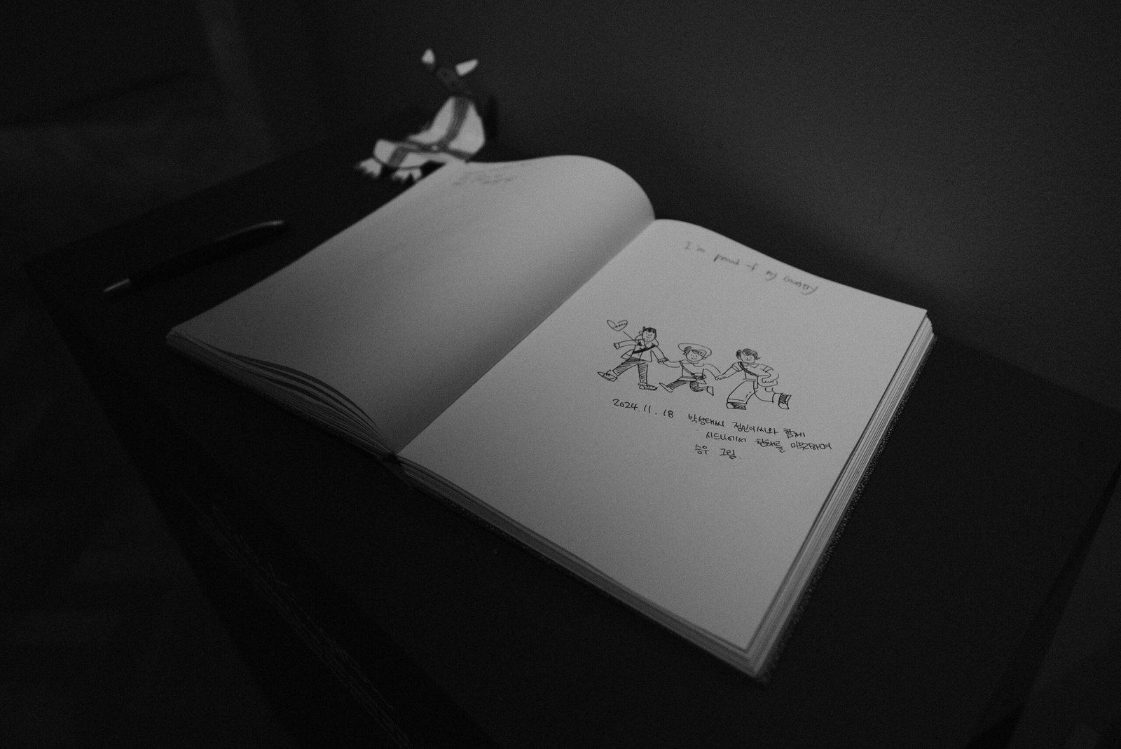 A black and white photo of an open book