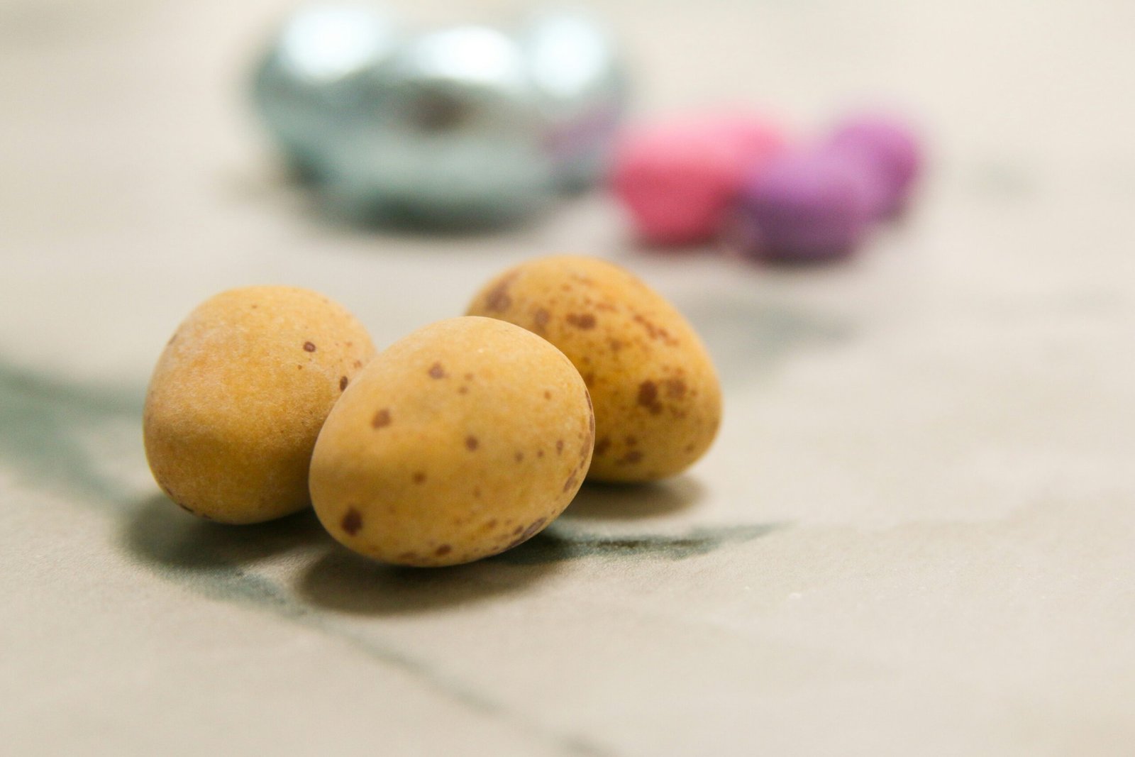 Speckled candy eggs are the image's main focus.