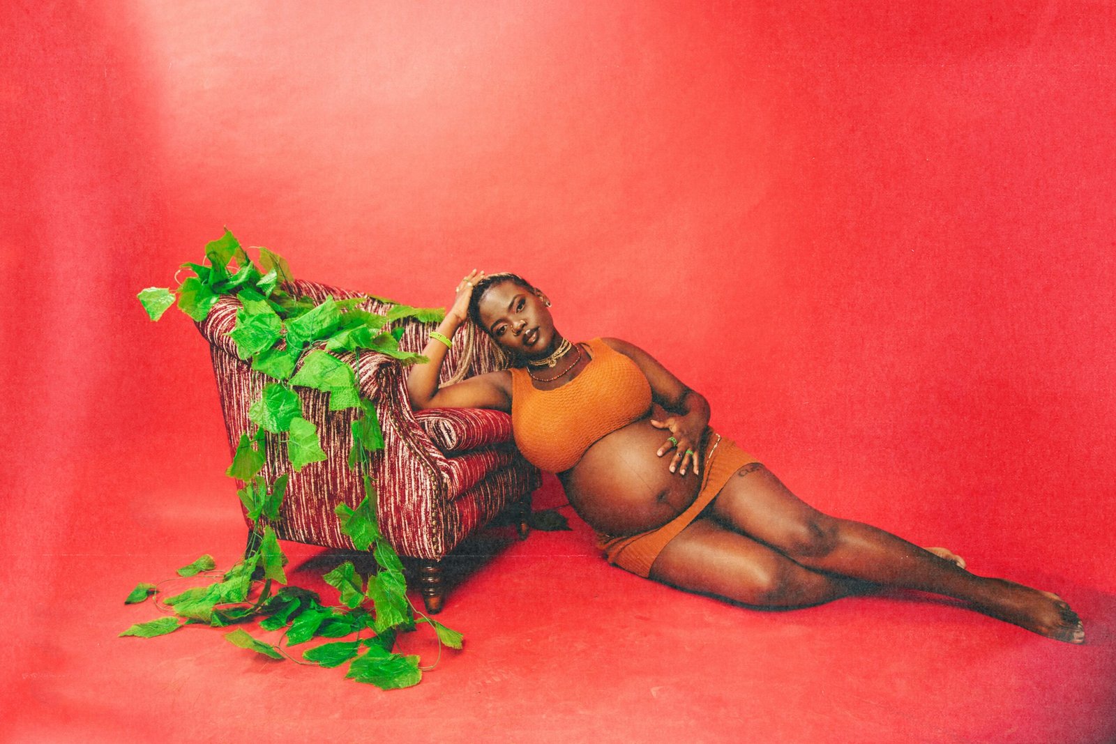 A painting of a woman laying on a couch