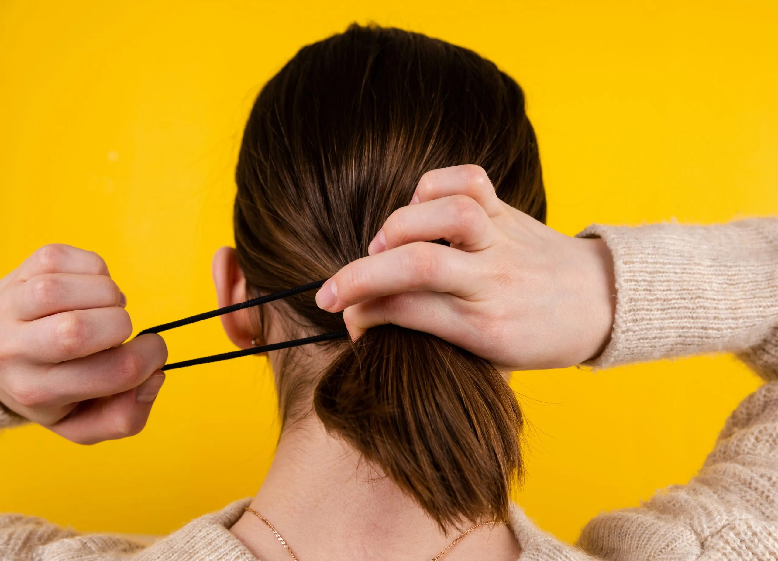 a person holding the head with the hands