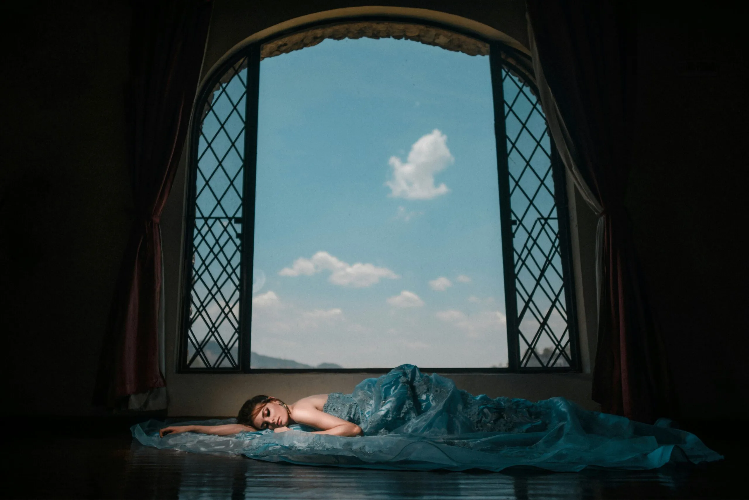 woman lying beside window