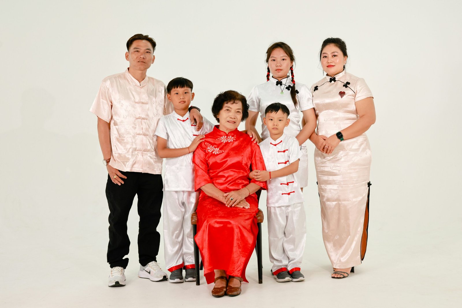 A multi-generational family posing for a formal portrait.
