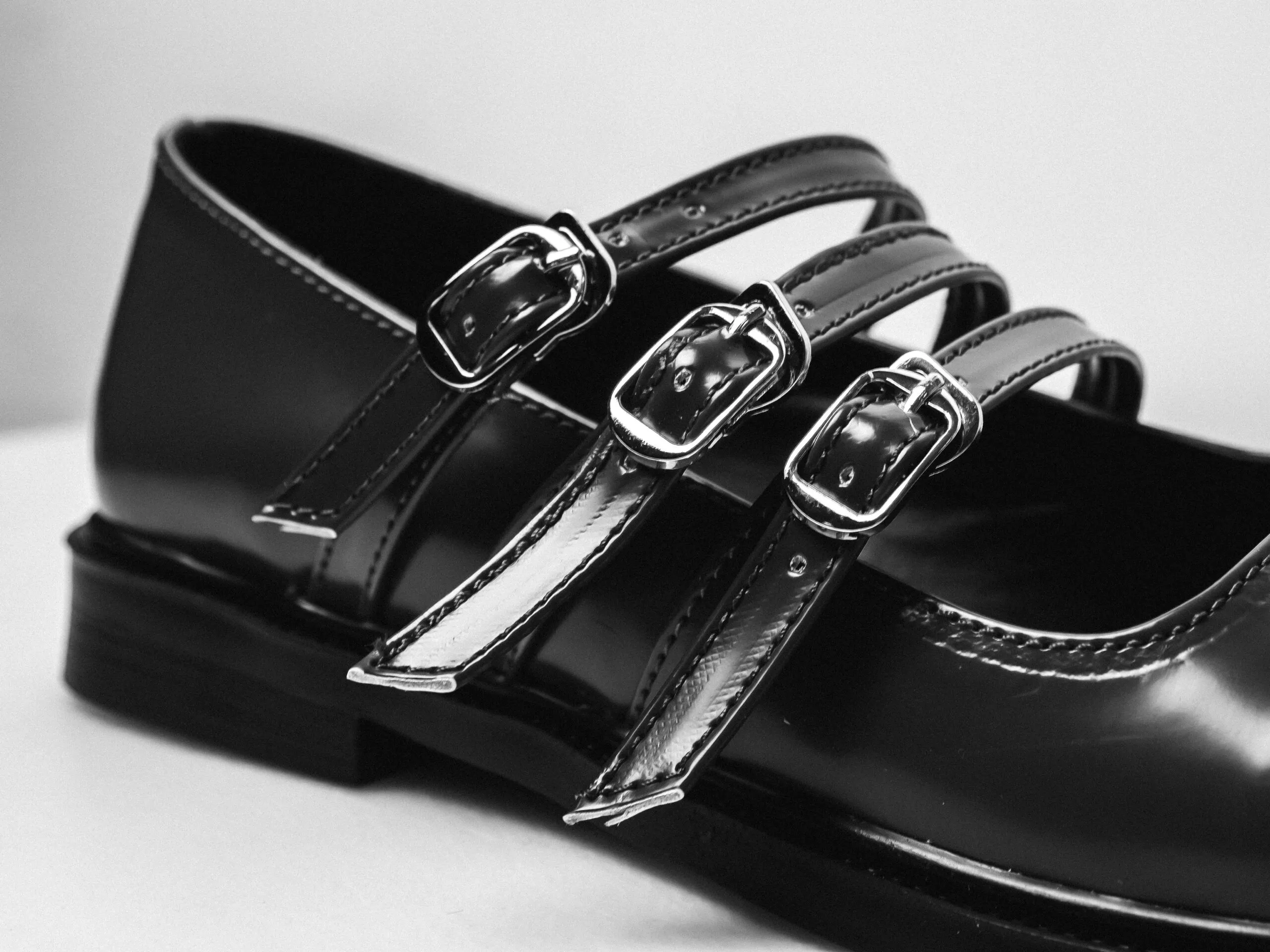 Black leather shoe with three buckles