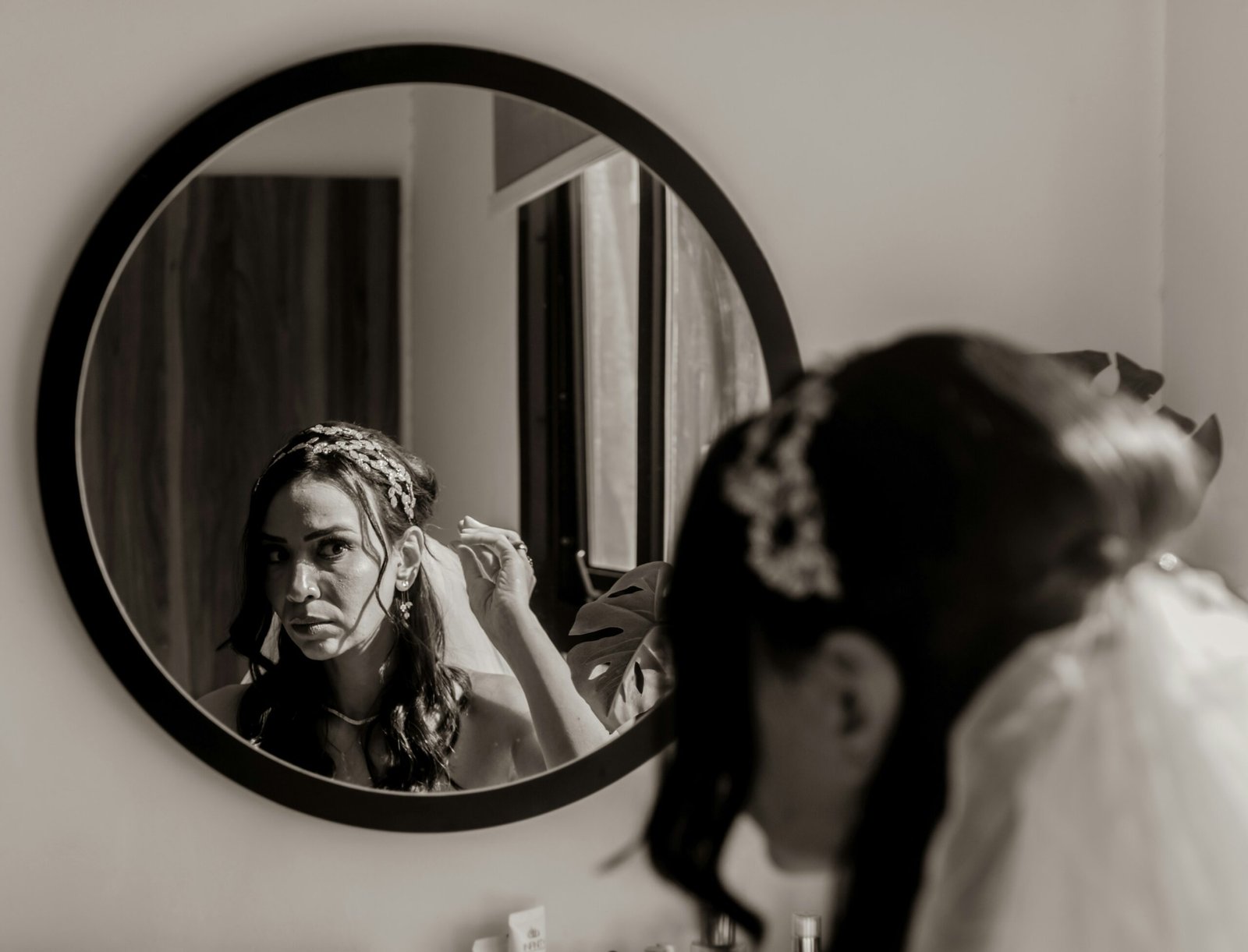 A woman is taking a picture of herself in the mirror