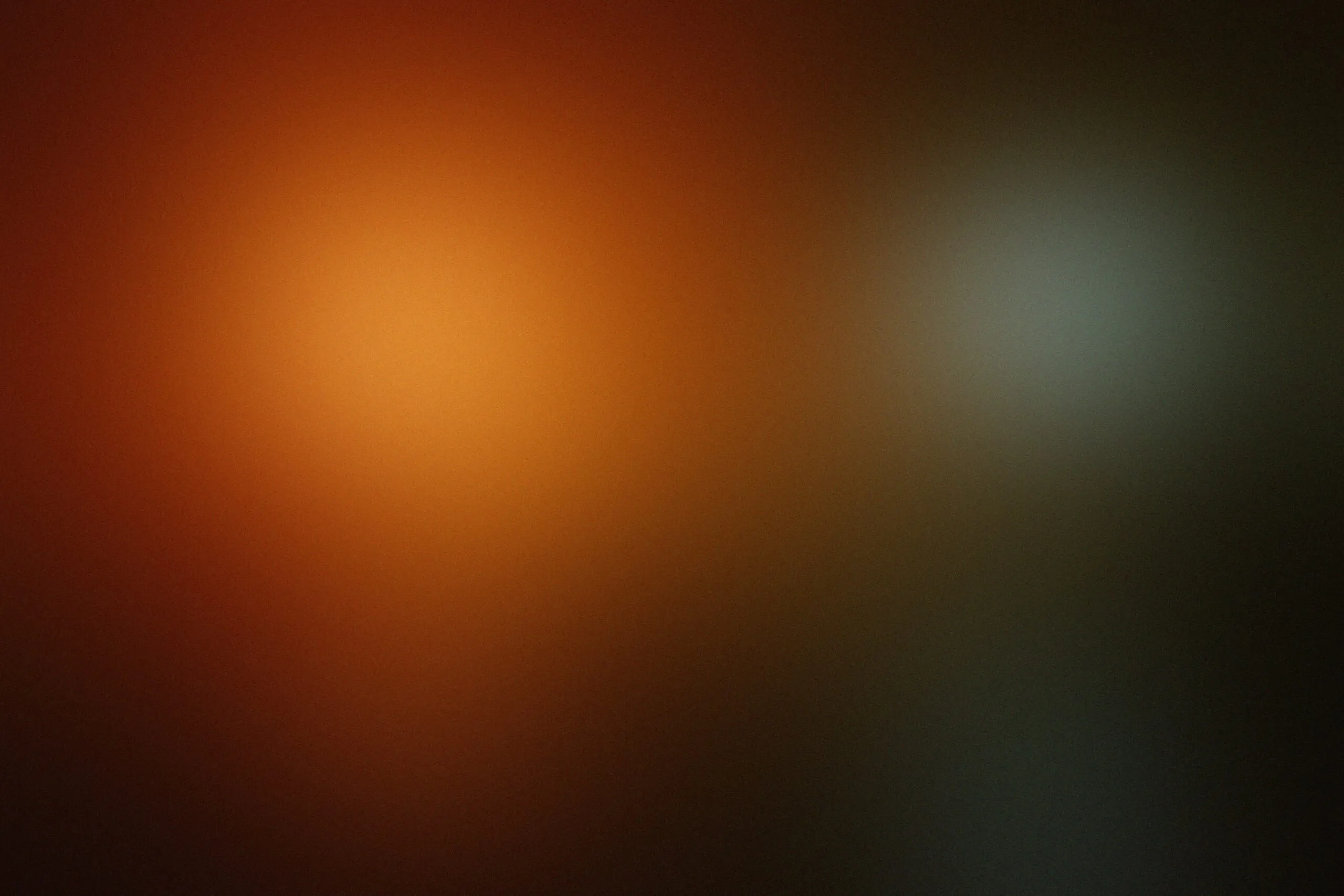a blurry image of a black and orange background