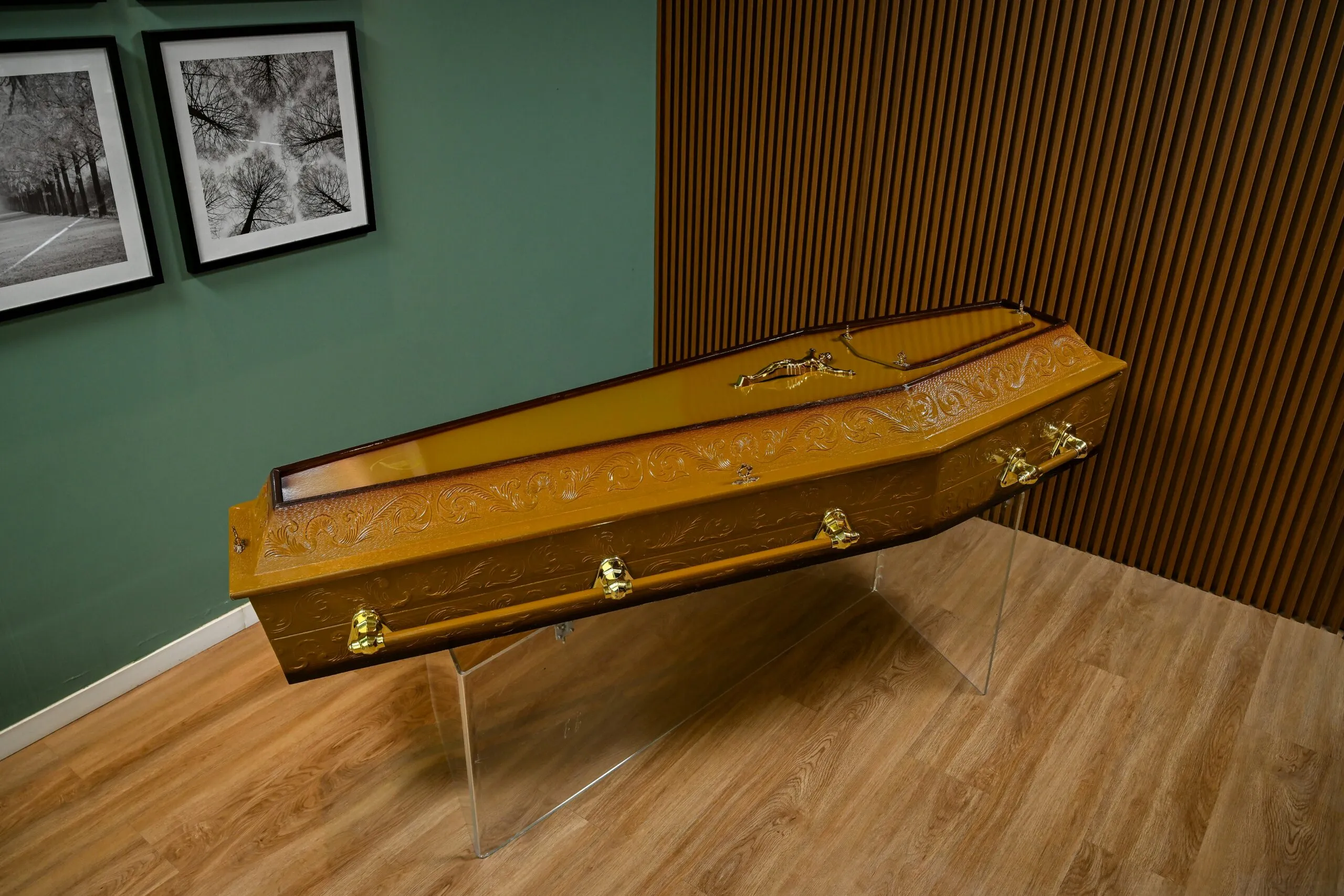 A wooden trunk sitting on top of a wooden floor