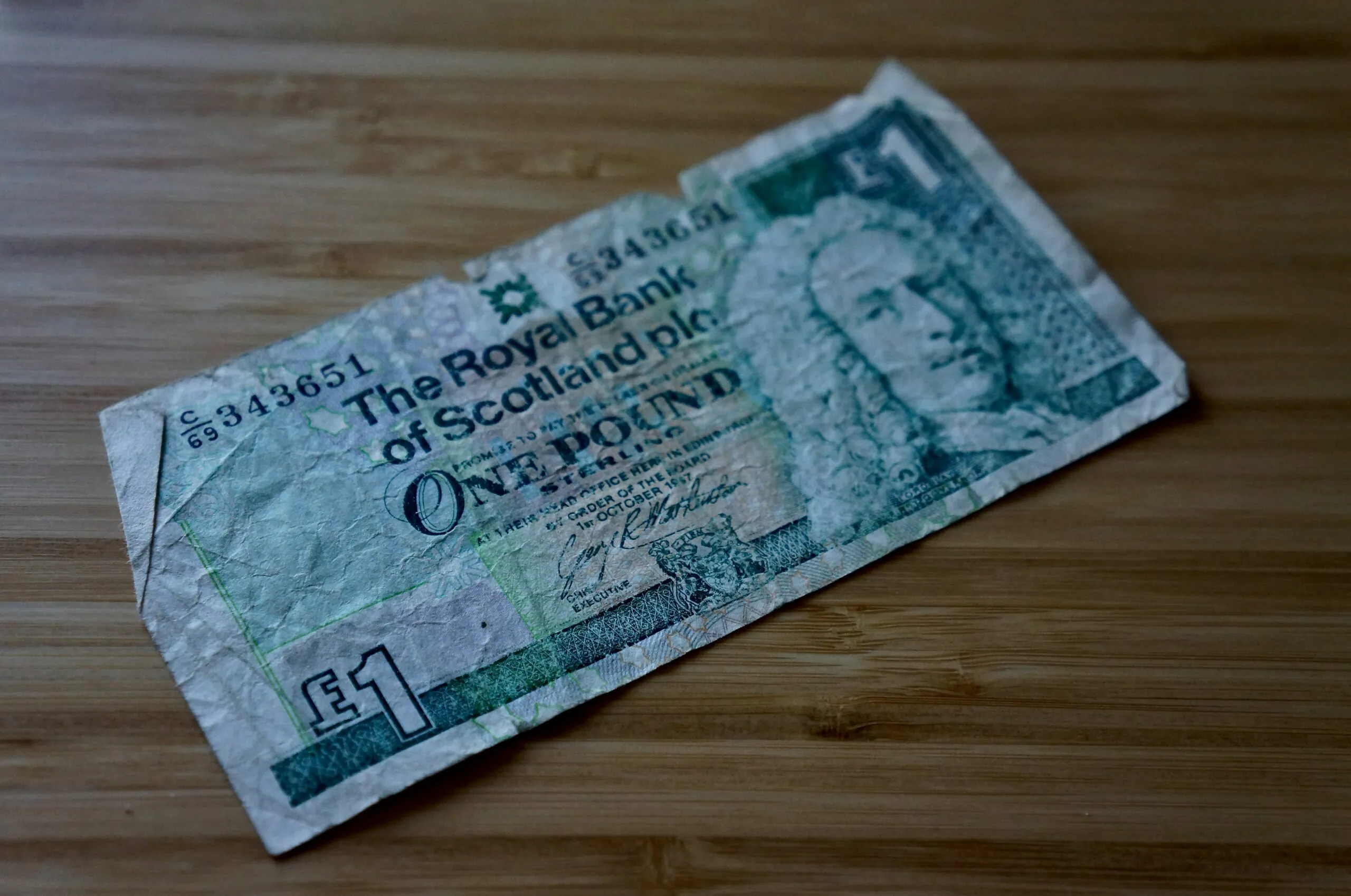 1000 banknote on brown wooden table