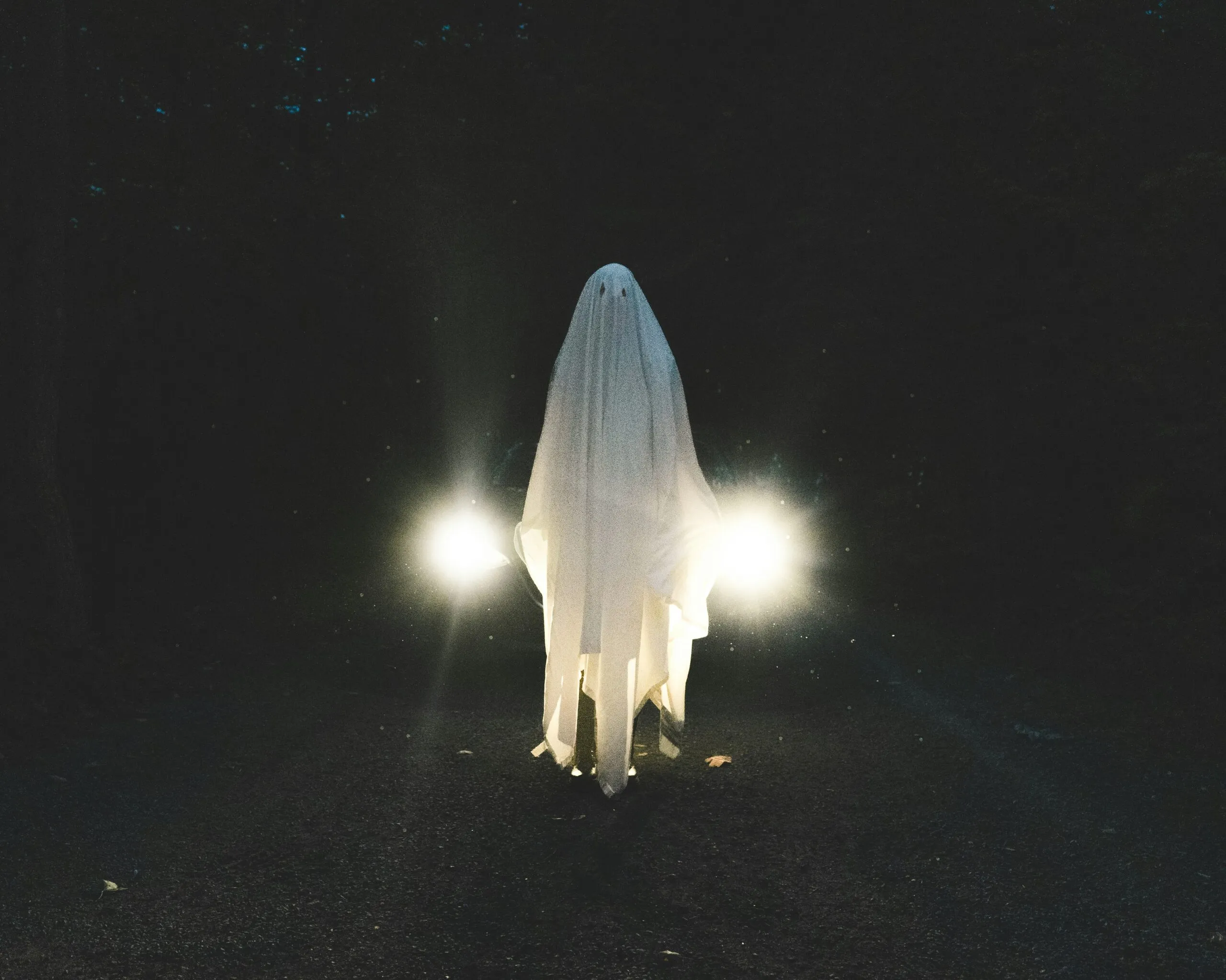 a person standing in the dark