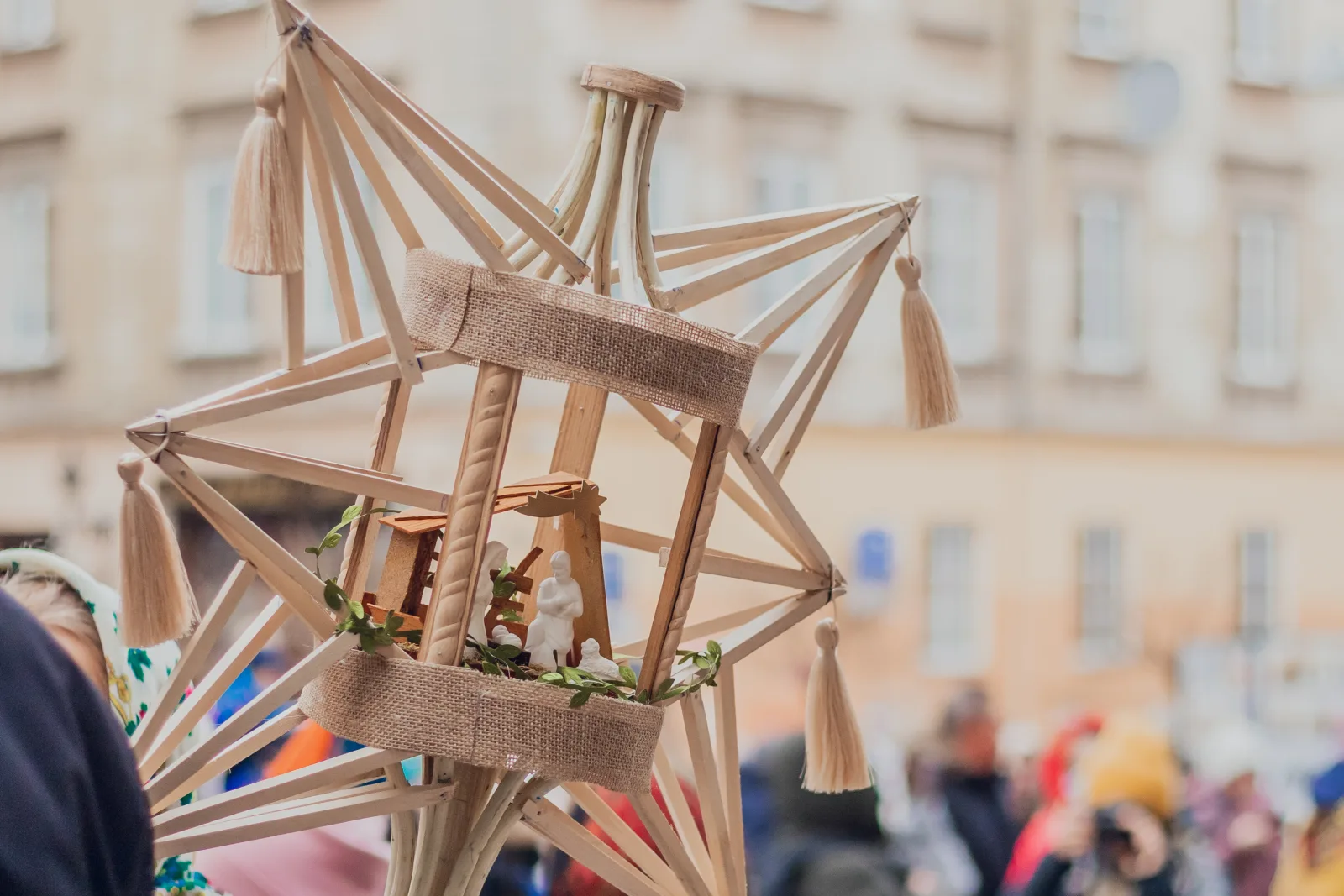 In this photo, we see a beautifully crafted handmade wooden star that depicts the miracle of Christmas. The star is carefully carved from a piece of wood, with intricate details and a stunning finish that highlights the natural grains of the material. As we look closer, we can see that the star has been adorned with various symbols that tell the story of the Nativity. At the center of the star is a small manger, with a tiny baby figurine nestled inside, surrounded by figures of Mary and Joseph. The craftsmanship of this wooden star is truly remarkable, and it serves as a reminder of the true meaning of Christmas - the celebration of the birth of Jesus Christ. 
This photo was taken for the volunteer project "Ukraїner" on January 8, 2022.
