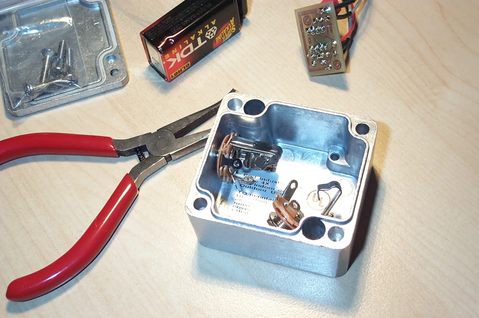 Mini Bud case that will soon house my buffer.
Flickr Tags: buffer case ic screws jack jacks bud box 9v battery alumnium diy effect effector effects pedal effects pedal guitar guitar effect music-object.

from Flickr album "Electronics" by germanium

"Building, modifying or repairing guitar amplifiers and effects myself."
References
Johann Burkard (2007-03-10). Build a buffer. Effects, johannburkard.de. "In this tutorial, I’ll show you how to build a buffer pedal. / For an introduction to buffers, see Jack Orman’s “Basic Buffers” article."
Jack Orman (2003-04-12). Basic Buffers. Lab Notebook &amp; Guitar Effects, amzfx (muzique.com). ""
Die Cast Aluminum Enclosure - NEMA 4. Willoughby, Ohio: BUD Industries.