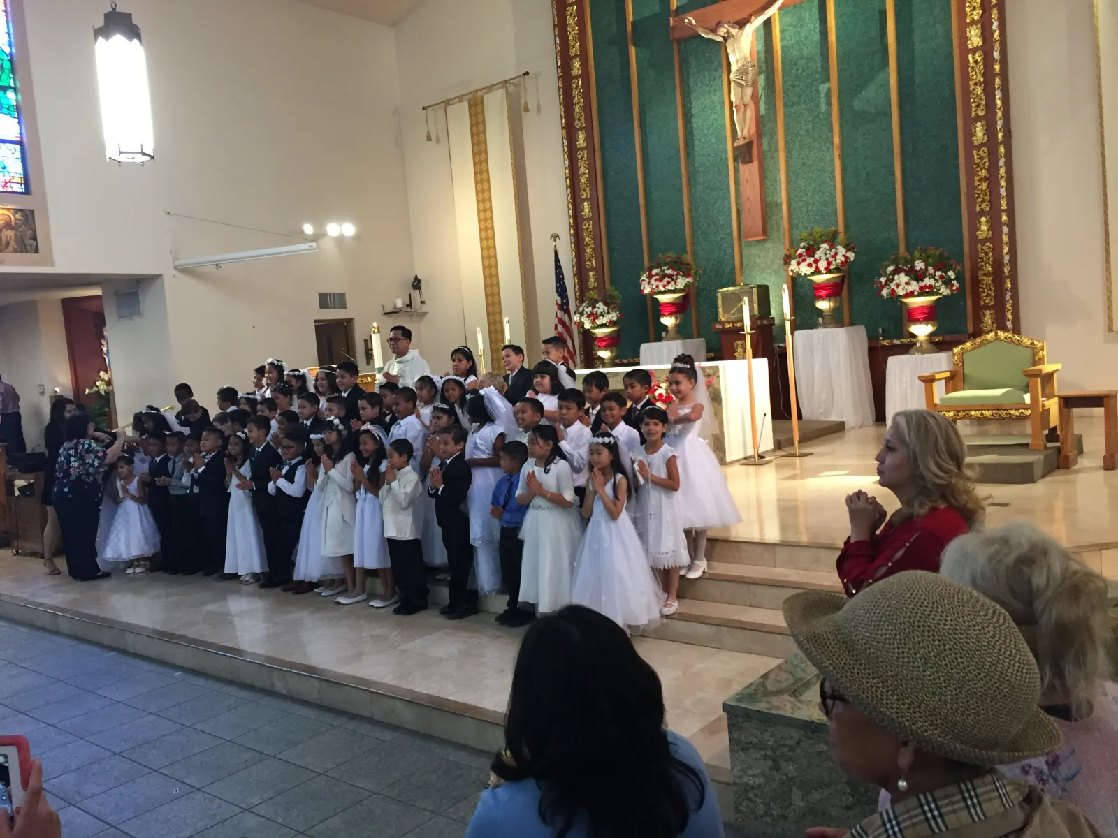 Interior of the Holy Family Catholic Church in Artesia in 2018, during a celebration of First Communion