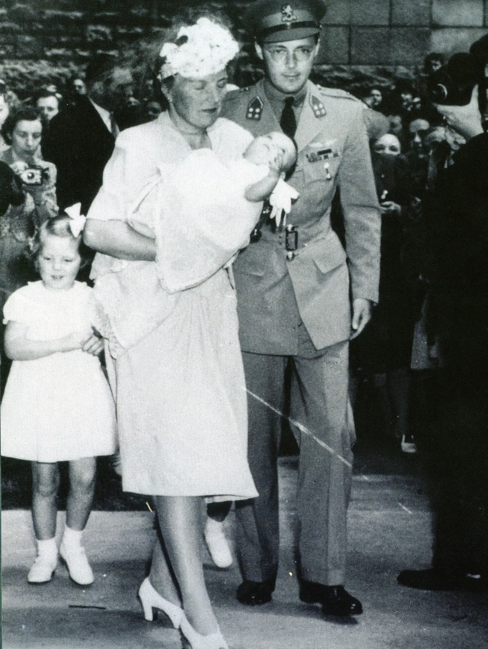While resident in Ottawa during the Nazi occupation, Crown Princess Juliana gave birth to Princess Margriet at the Civic Hospital. Here the family is shown with the new child after the christening at St. Andrew's Church.