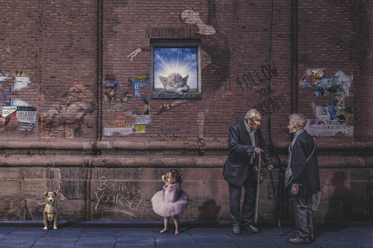 people, animal, adult, group, street, man, woman, elderly, walking stick, pet, dog, sitting, child, kid, girl, female, ballet, ballerina, tutu, pink dress, window, angel, cherub, light, wall, shadows, bricks, posters, pavement, believe, follow your dream, dream, urban, outdoors