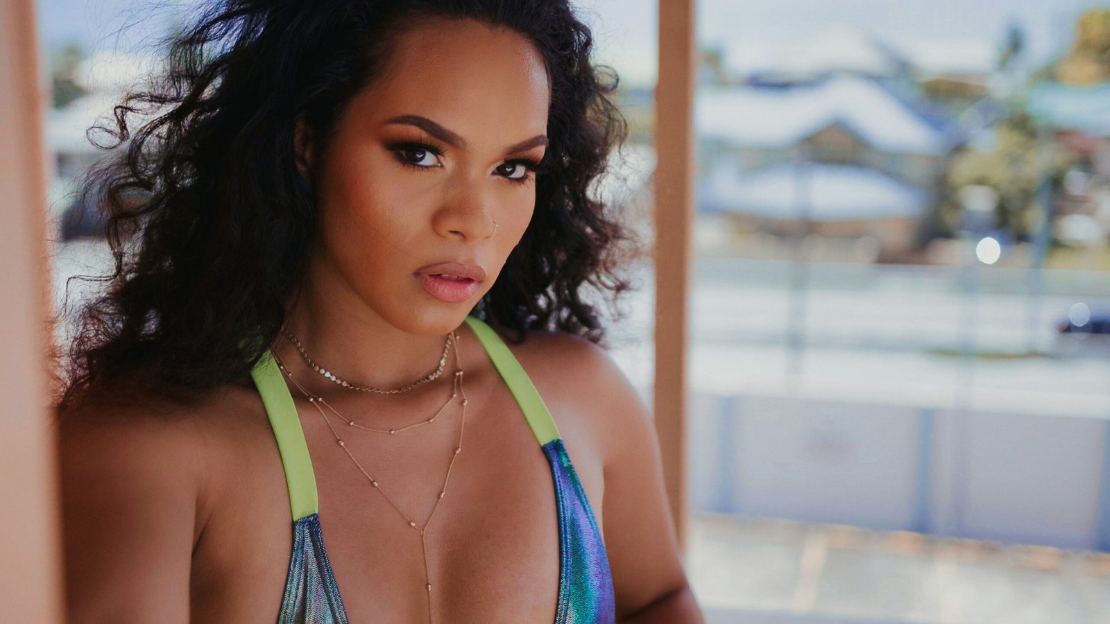 a close up of a person wearing a bikini top