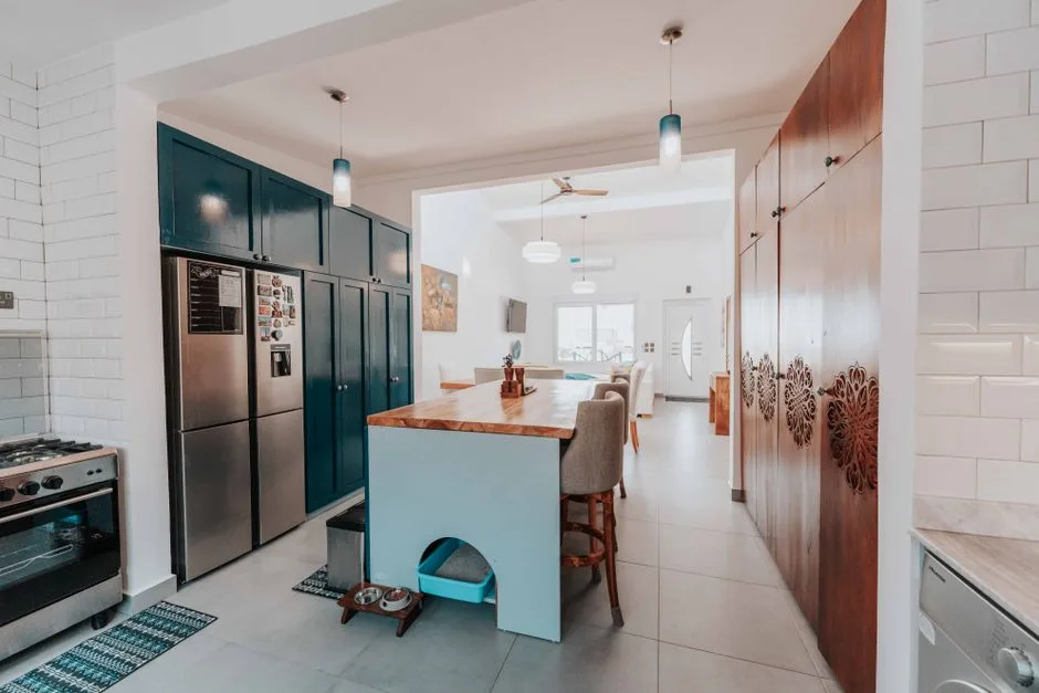 Spacious and stylish kitchen featuring a central island and modern design elements.