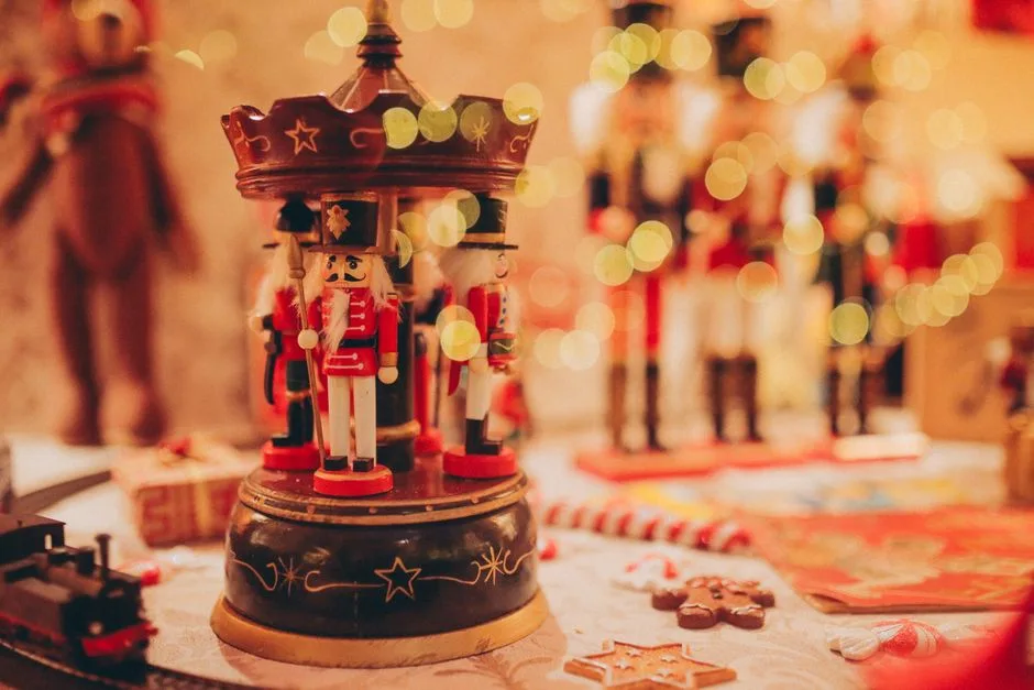 Close-up of traditional nutcracker figurines in a festive Christmas setting with bokeh lights.