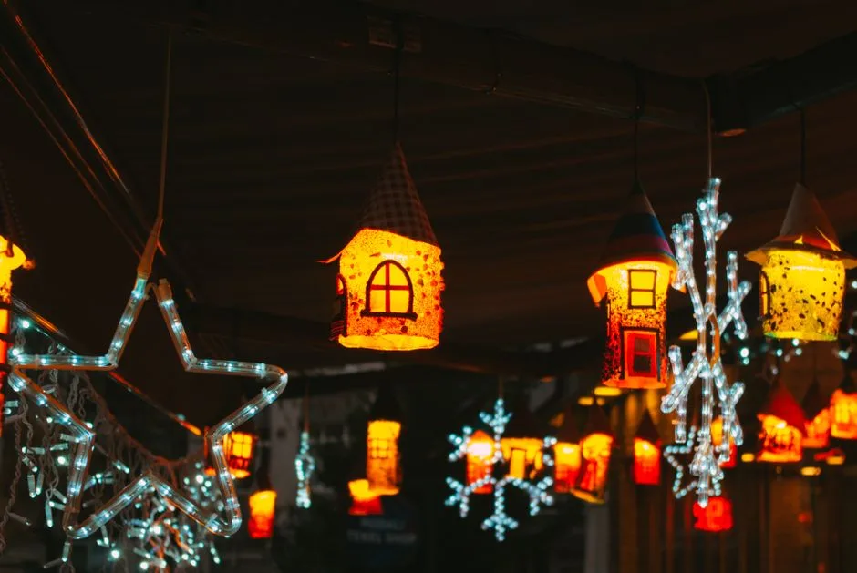 Charming lanterns and star decorations create a festive indoor atmosphere at night.