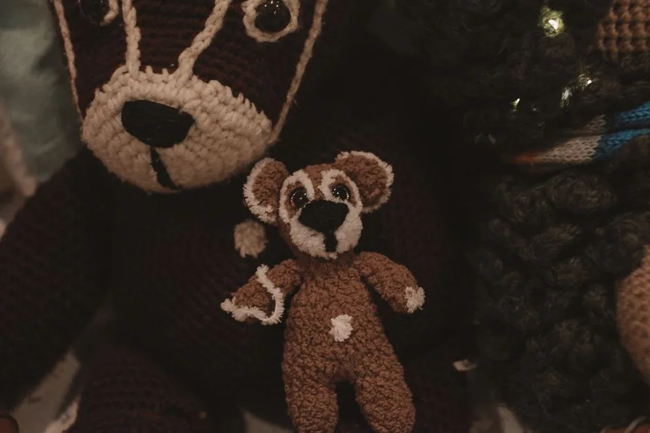 Close-up of handmade crochet teddy bear toys. Perfect for craft and DIY enthusiasts.