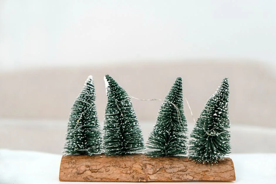 Handmade miniature Christmas trees on wood base, perfect for holiday decoration.
