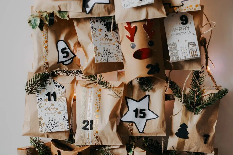 Creative DIY Christmas advent calendar with paper bags and holiday decorations.