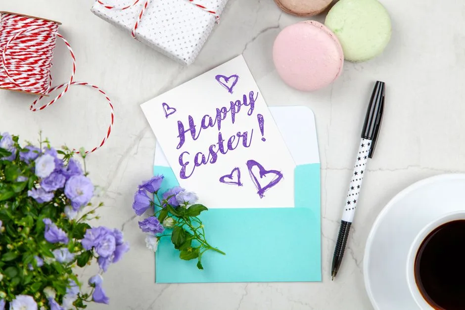 Top-down view of an Easter greeting setup with flowers, coffee, and gifts.