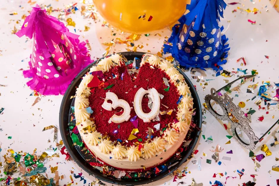Vibrant 30th birthday party scene with cake, decorations, and confetti.
