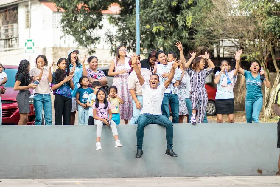 A diverse group enjoying a lively outdoor celebration, capturing the essence of a joyful family gathering.