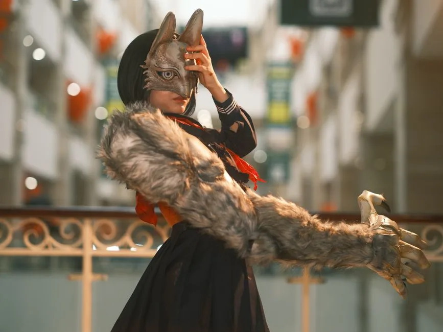 Creative cosplay featuring a wolf mask and claws in an indoor setting. Perfect for fantasy theme.