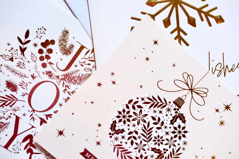Elegant holiday greeting cards with ornaments and snowflakes, perfect for the festive season.