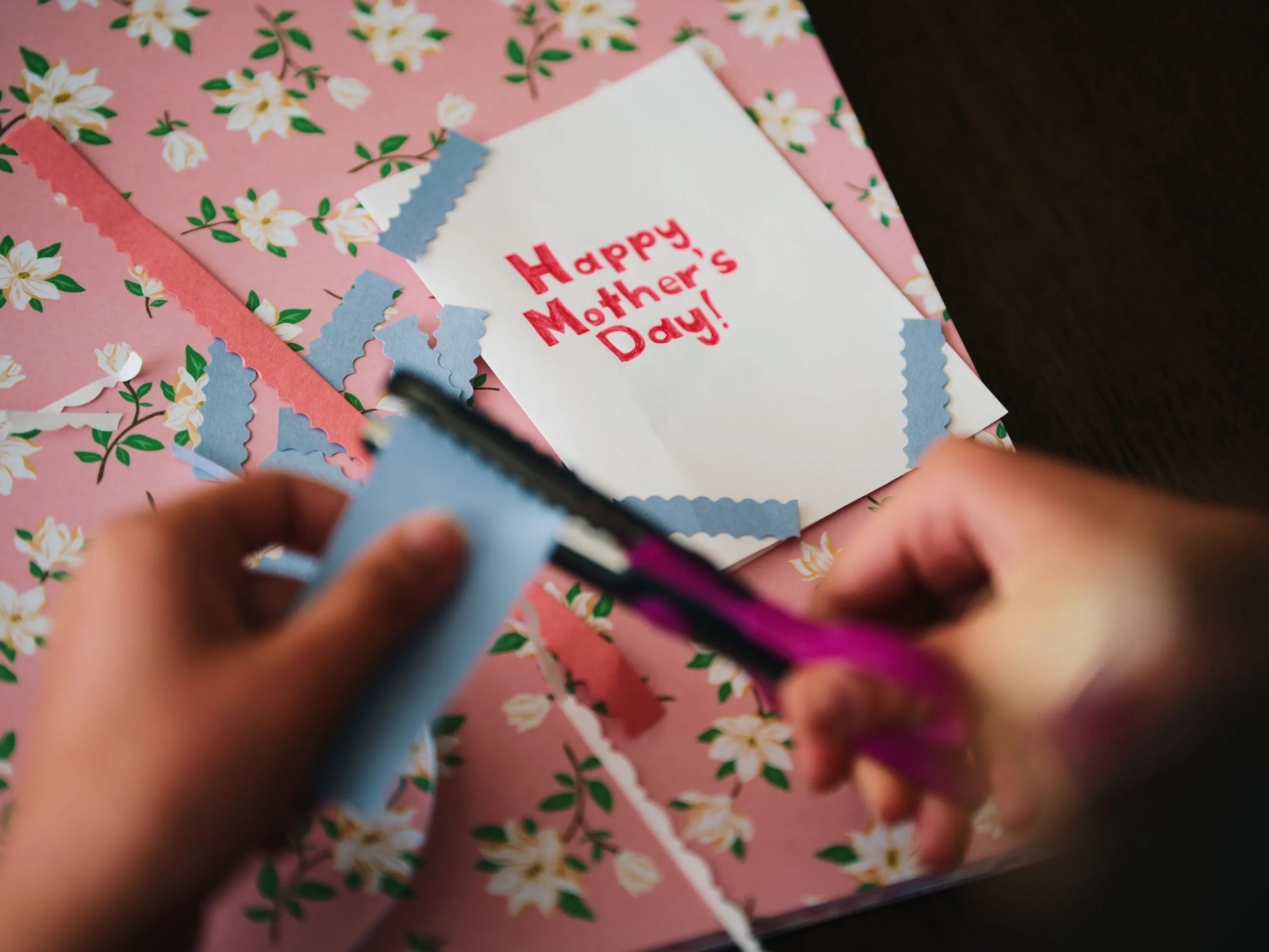 Creative Mother's Day card crafting with floral paper and scissors