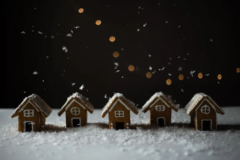 Charming gingerbread houses dusted with snowflakes, evoking a festive winter mood.