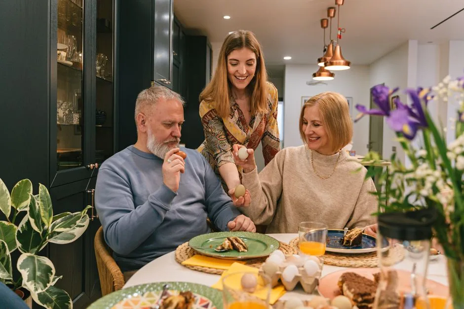 A joyful Easter celebration with a family around a dining table. Smiling, sharing, and enjoying festive moments together.