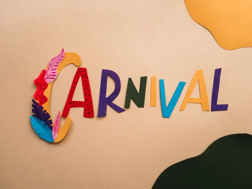 Vibrant paper cutout letters spelling 'Carnival' on a creative and colorful background.