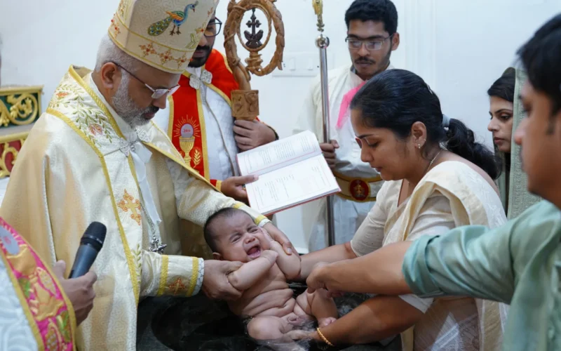 Baptism of Isahaq Ninan Payyappilly by bishop Mar Joseph Srampickal