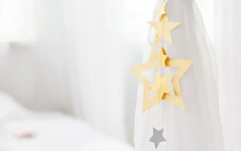 Elegant star-shaped paper ornaments on white background, ideal for minimalist decoration themes.