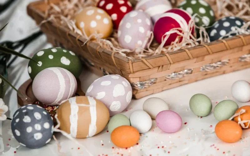Decorative Easter eggs arranged in a basket, symbolizing traditional celebrations.