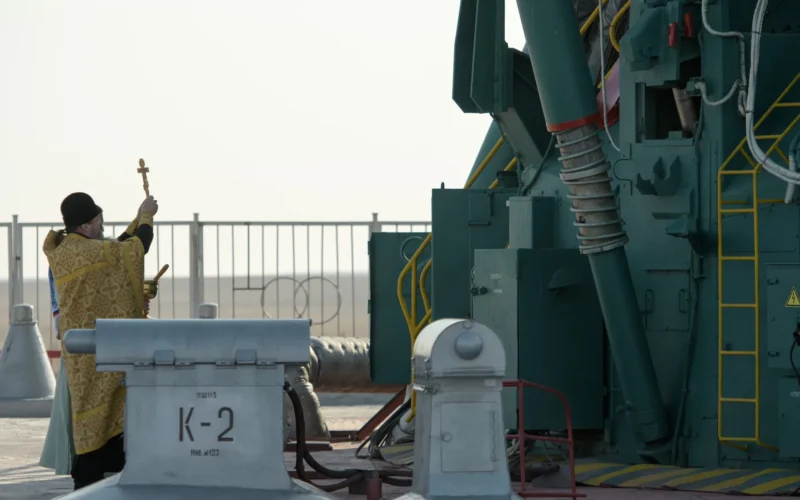 Russian Orthodox Priest Father Sergei blesses the Soyuz rocket at the Baikonur Cosmodrome launch pad, Thursday, March 14, 2019 in Baikonur, Kazakhstan. Expedition 59 astronauts Nick Hague and Christina Koch of NASA, along with Alexey Ovchinin of Roscosmos will launch later in the day, U.S. time, on the Soyuz MS-12 spacecraft from the Baikonur Cosmodrome for a six-and-a-half month mission on the International Space Station.