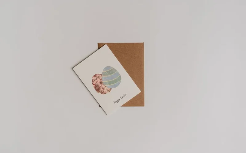 Elegant Easter card design featuring decorative eggs on a minimalistic background.