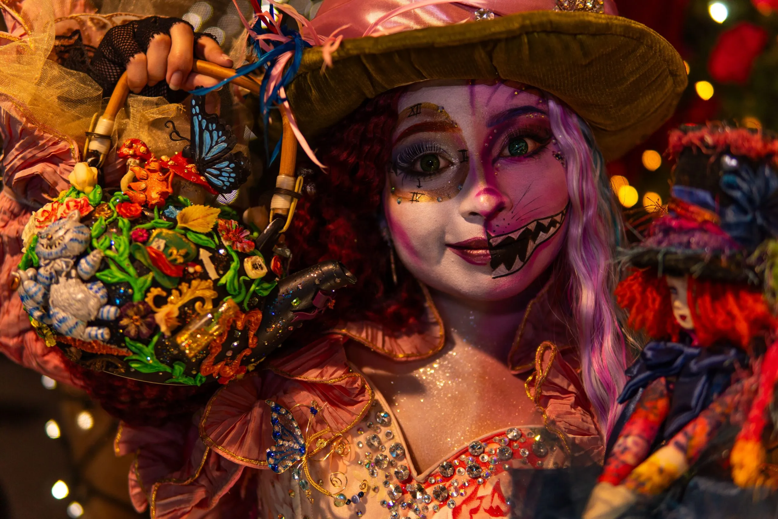 Enchanting Alice in Wonderland-inspired cosplay featuring vivid costumes and artistic makeup.