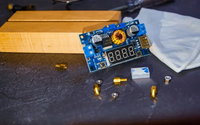 Detailed view of a circuit board and electronic components on a table.