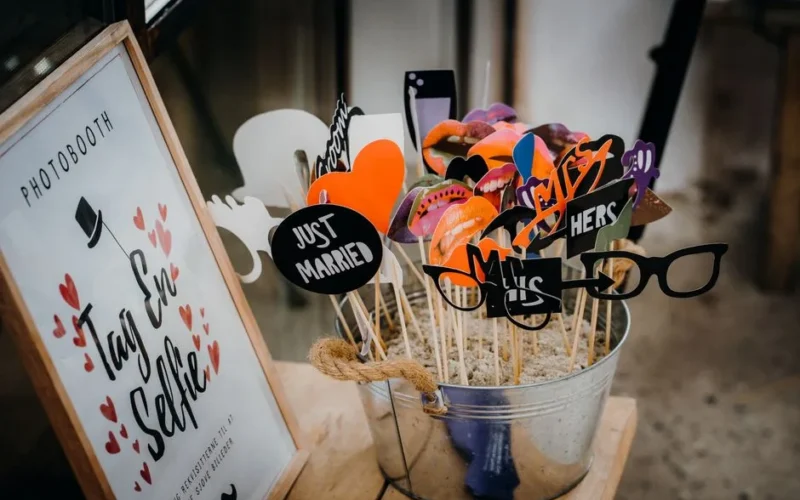 Creative wedding photobooth props with fun designs like glasses and moustaches.