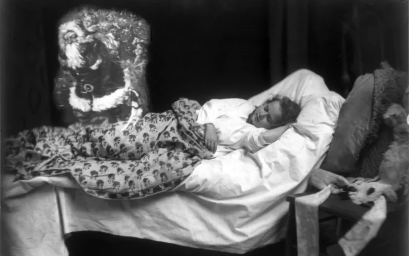 Photomontage of a child in bed dreaming of Santa Claus