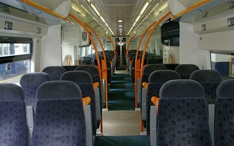 Interior of train running on Hastings- London railway line in England operated by Southeastern, as shown by the seat moquette.