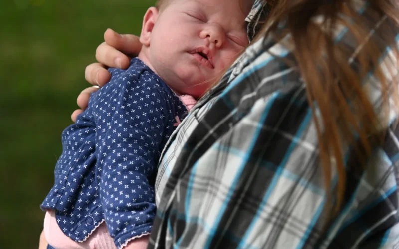 U.S. Army Garrison Stuttgart community member, Katherine Gavitt, holds her newborn daughter, Eritrea Gavitt, outside her home at Patch Barracks on April 23, 2020. Gavitt gave birth to her daughter at home on April, 8 2020, before paramedics could arrive. (U.S. Army photo by Becca Castellano)