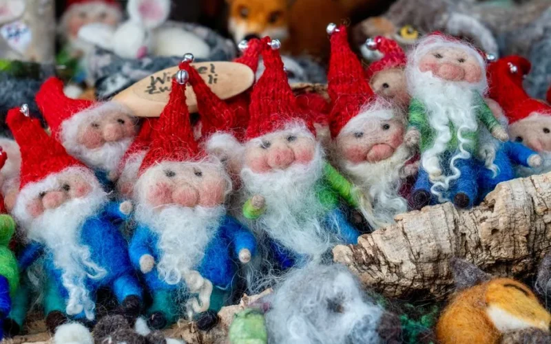 Charming felt gnomes with red hats and white beards, perfect for festive decor.